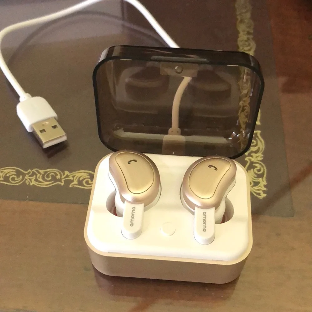 - Blue tooth ear buds. Rose gold. Like new. In case with charge cable.